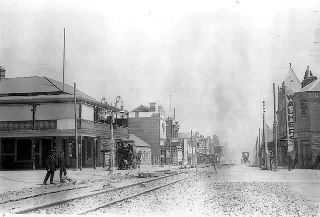Sydney road looking south from Bell St showing horse drawn tram rails being replaced late 1915 or early 1916 